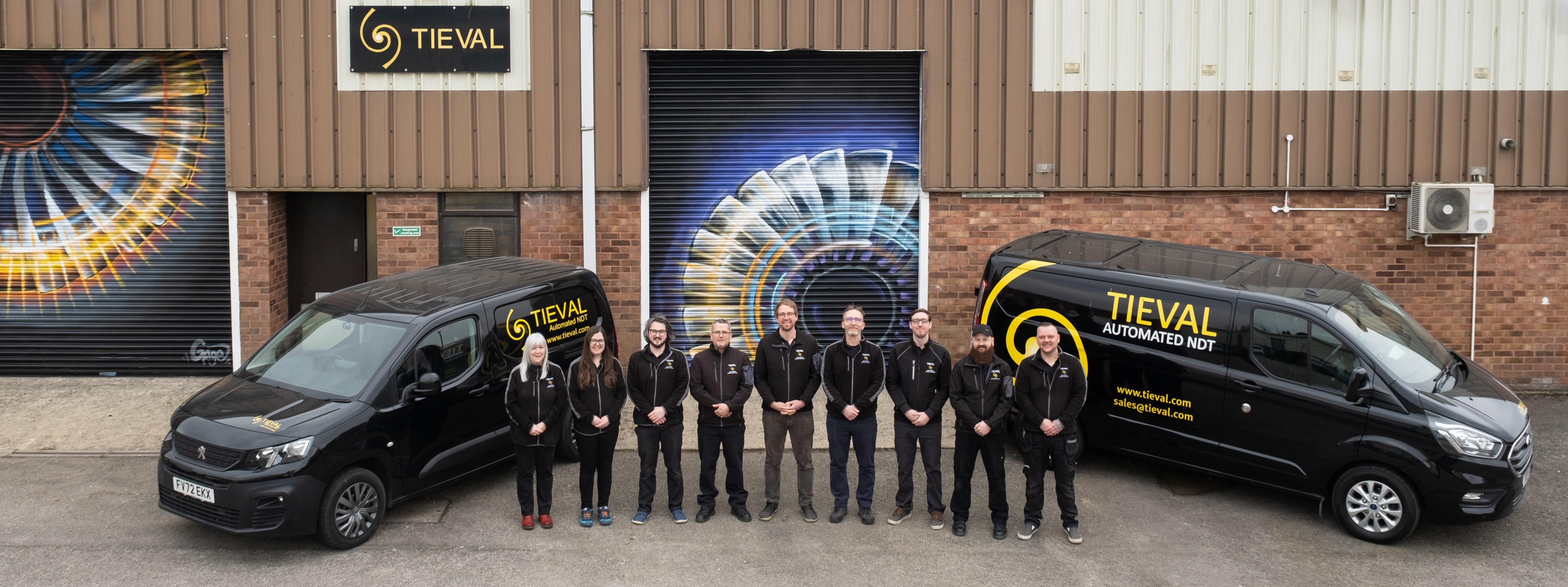 Team Photo featuring all Tieval staff and a Tieval van